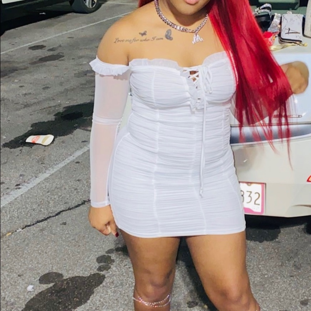 A white mini dress , very cute and fancy .